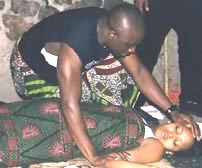 Uloko f(Oliver Mbamara) finds the demised Ogwoma (Nkiru Duru)