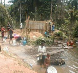 Youth in the village engaging in community activities in and around the river